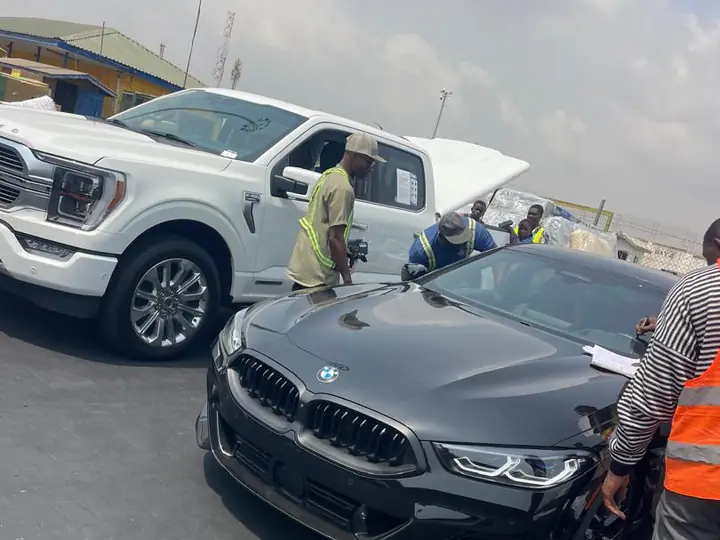 Vehicles and a team in the port yard