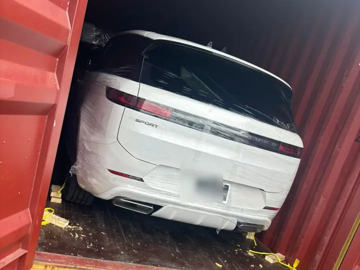 A protected vehicle loaded inside a container