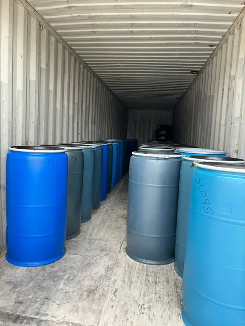 Plastic drums loaded inside a container