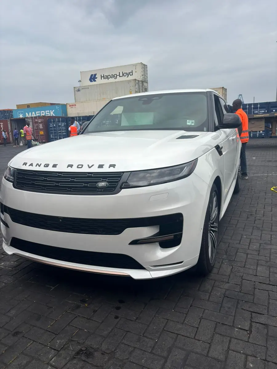 A white Range Rover at the container terminal