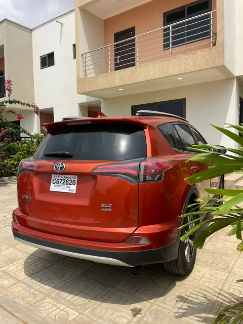 A red RAV4 delivered to a residence