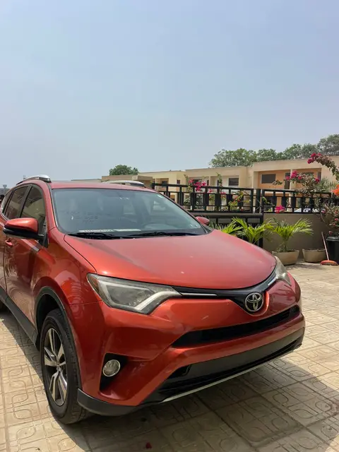 A red RAV4 at its destination